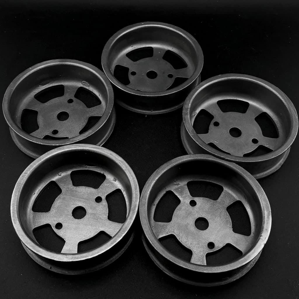 Five cast wheel hubs made for an exo-suit company